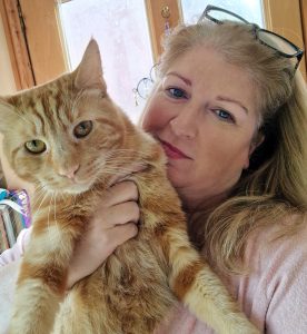 Author Samantha Mattocks with Mister Mishkins, a ginger cat